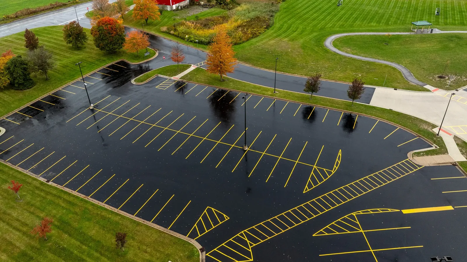 Newly paved and striped commercial parking lot seen from above